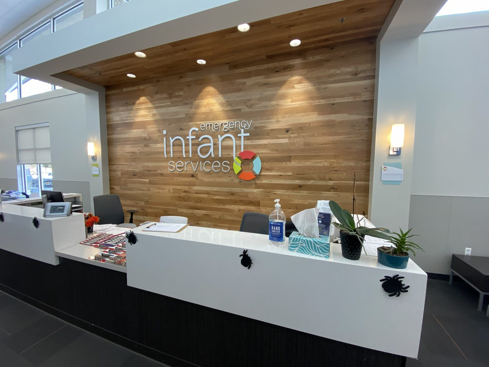 Reception logo on wood slat wall