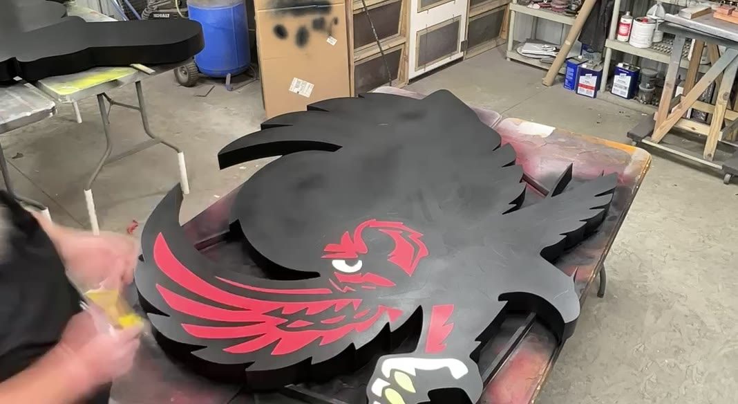 Hand-finishing a mascot logo