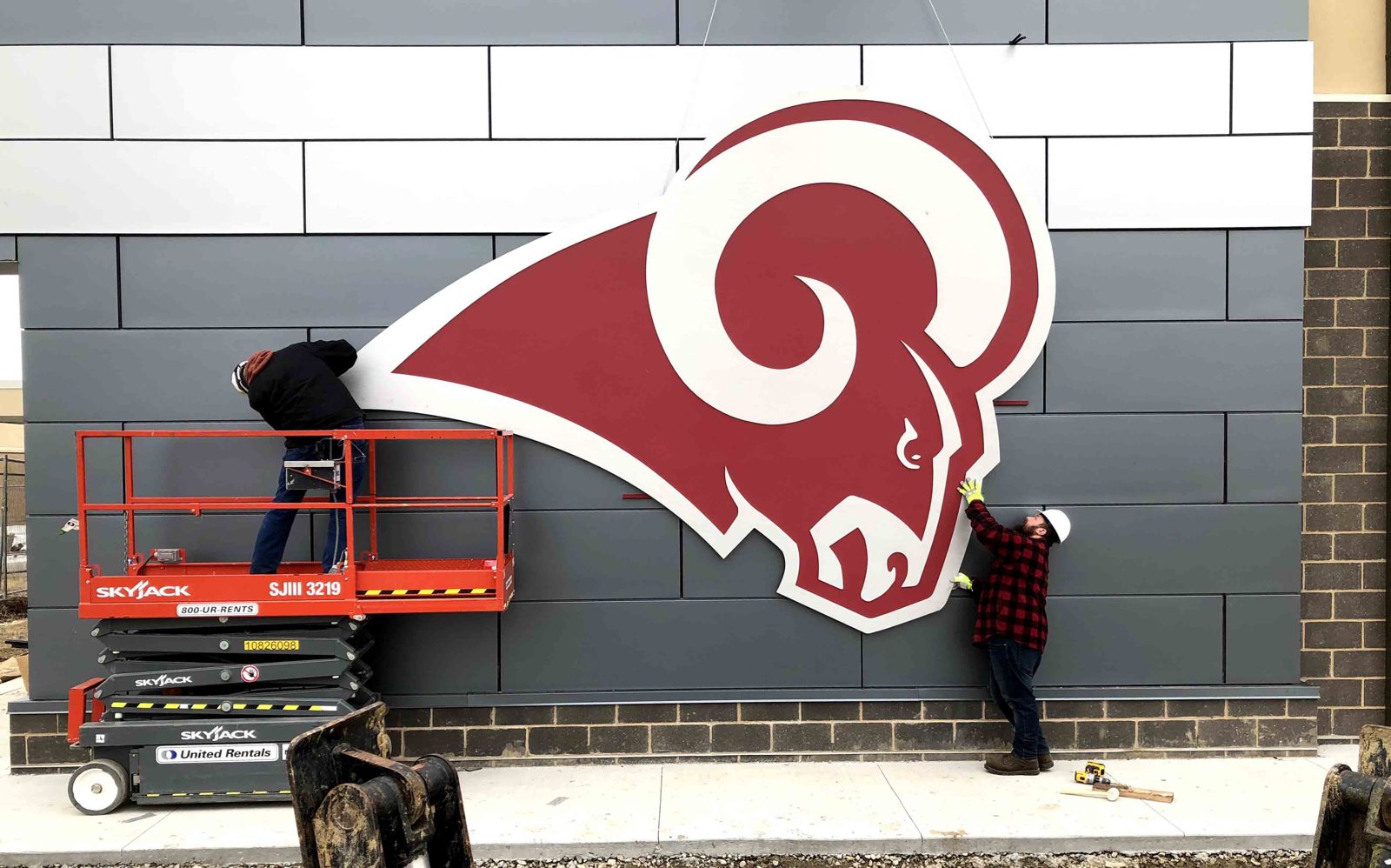 Setting a mascot on the field house